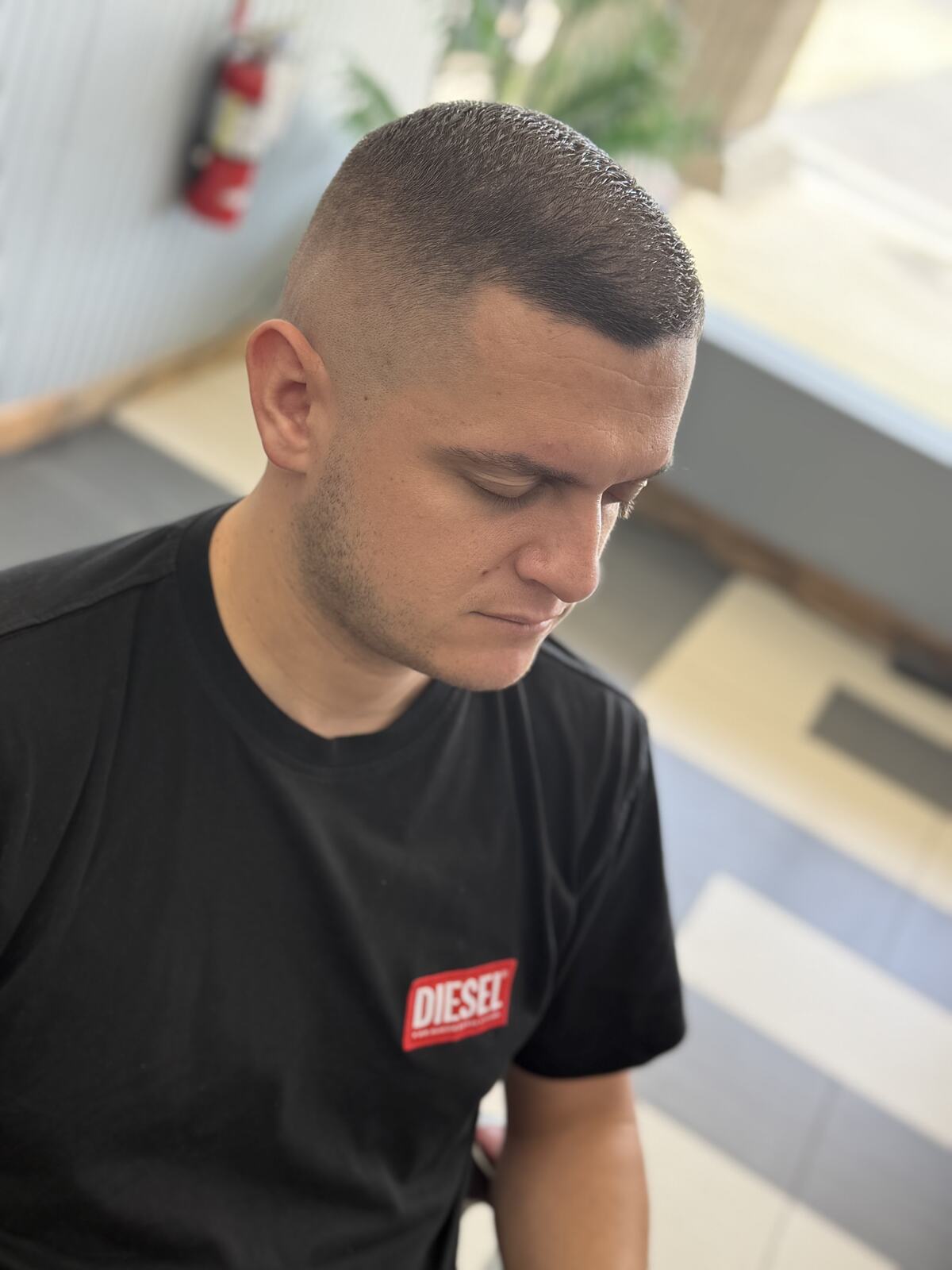 A client with a fresh short fade